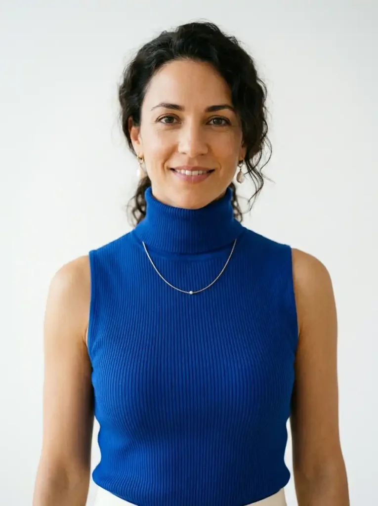 The Sleeveless Turtleneck Styled for Warm Weather