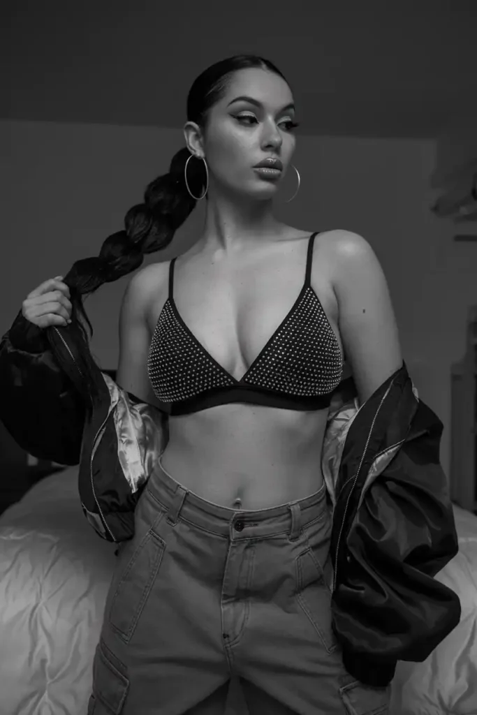 Y2k pop star with a dark high ponytail